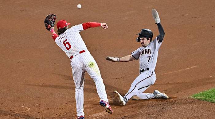 Diamondbacks’ Corbin Carroll steals second base vs. the Phillies in the NLCS.